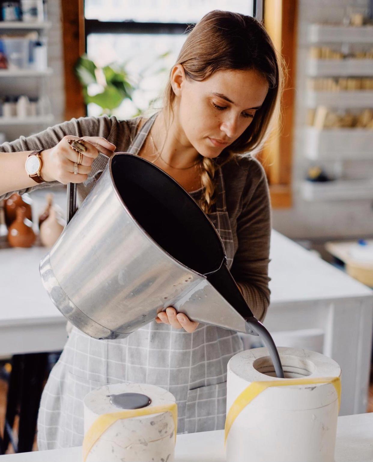 Woman Pouring Into Molds