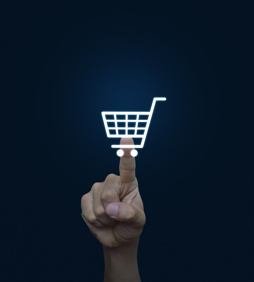 Finger pointing on shopping cart icon