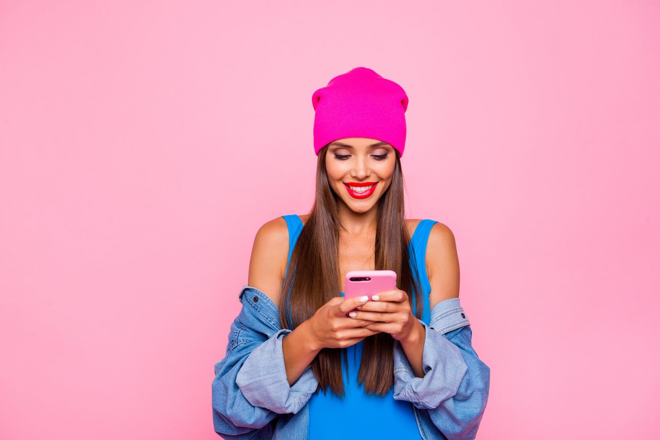 Woman influencer holding phone