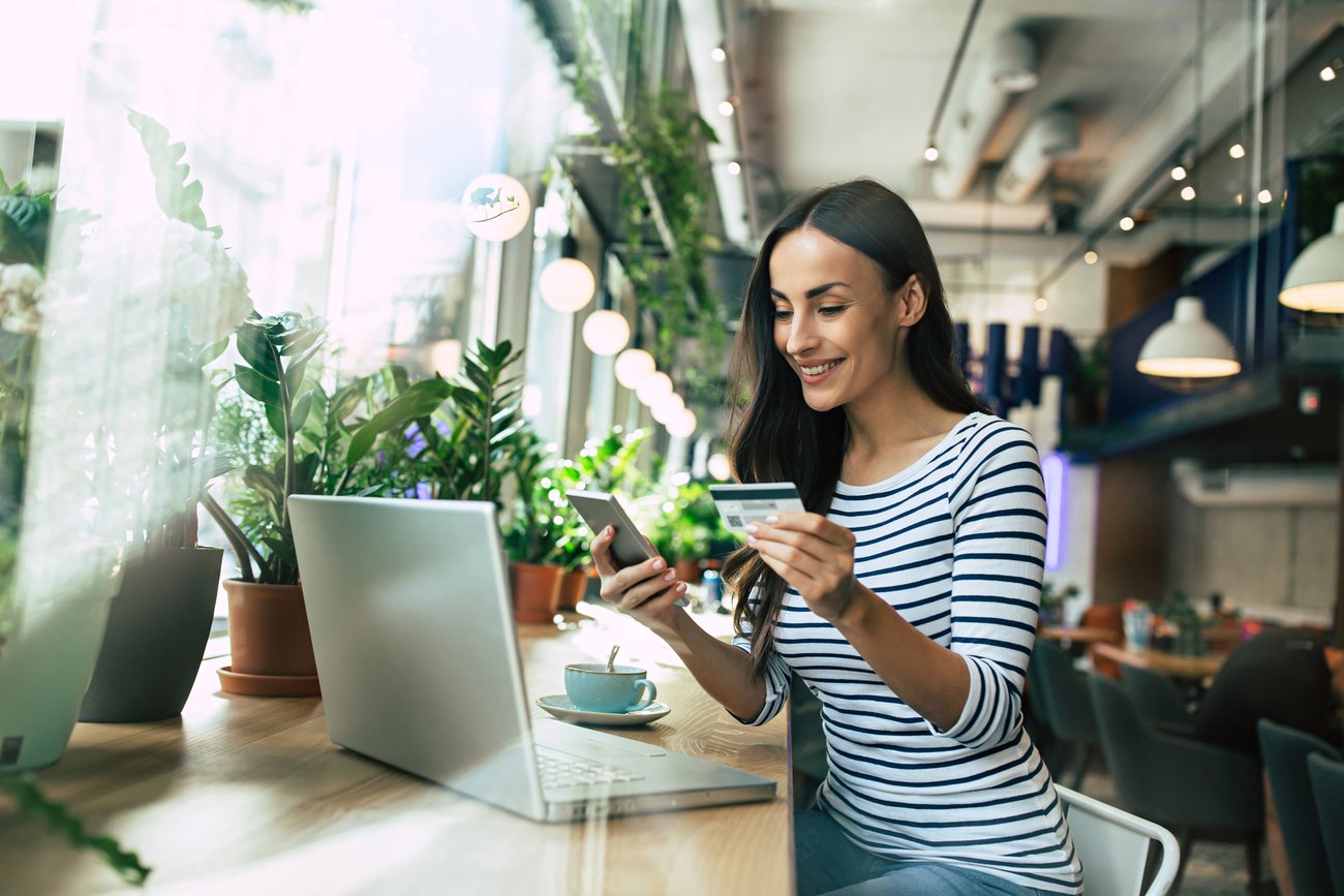 Woman working on a laptop in a local business