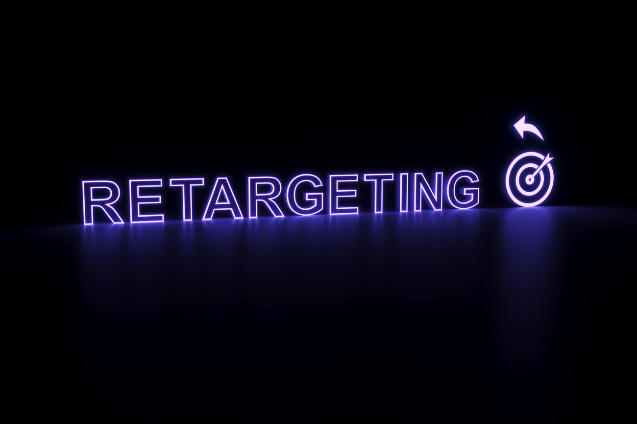 "Retargeting" in neon next to a neon target