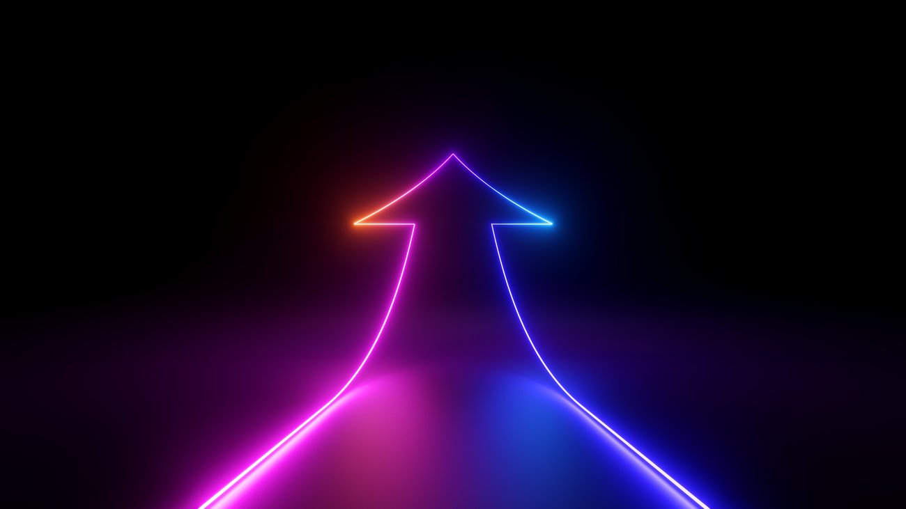 Neon lit arrow going forward and up