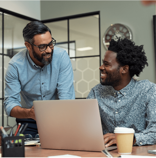 Two co-workers discussing how to grow online grocery delivery